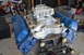 1981 Ford F-250 - Close-up of an engine block assembly, a carburetor and blue valve covers.