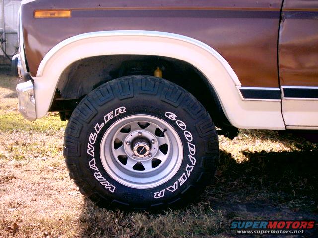 1980 Ford Bronco front wheel with Goodyear Wrangler tire and chrome bumper