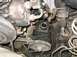 1973 Ford F-100 - Close-up view of a power steering pump assembly, including the belt and pulley system.