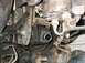 1973 Ford F-100 - Close-up view of a vehicle's power steering pump and drive belt system.
