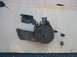 1973 Ford F-100 - A disassembled power steering pump assembly, including brackets and nuts, is laid out on a surface.