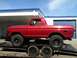 1978 Ford Bronco - A bright red 1978 Ford Bronco is seen on a trailer, equipped with BFGoodrich Mud-Terrain T/A tires.