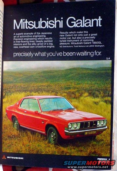 Red Mitsubishi Galant coupe parked in a grassy field, front grille visible with MITSUBISHI badge