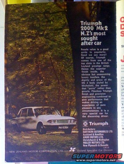 White Triumph 2000 Mk2 sedan parked in a wooded area