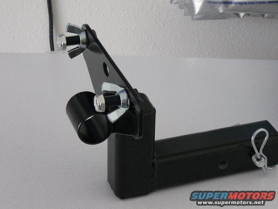 Black metal hitch receiver accessory mount with wing nuts and a clevis pin