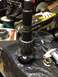 1996 Ford Bronco - Differential gear and pinion assembly, likely for a D44 axle, shown with a bearing and digital caliper for measurement.