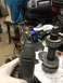 1996 Ford Bronco - Close-up of automotive differential components and a rotary tool, suggesting repair or modification work.