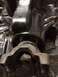 1996 Ford Bronco - Detail of a vehicle's differential housing and a connected suspension component, likely a part from a Ford Bronco.
