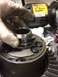 1996 Ford Bronco - A differential part is shown with a 6" bench grinder visible in the background.