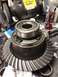 1996 Ford Bronco - Differential gear and bearing assembly shown with a bench grinder and drink bottle.