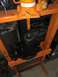 1996 Ford Bronco - Automotive part being worked on in a hydraulic press. Serial number visible on the press.