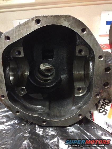 Differential housing with Spicer branding visible, showing internal bearing mounts