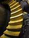 1996 Ford Bronco - Differential ring gear with yellow coating and visible teeth.