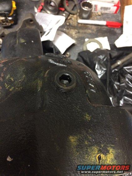 Close-up of a differential cover with a hex plug