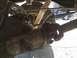 1996 Ford Bronco - Close-up view of the rear axle, leaf springs, and driveshaft U-joint.