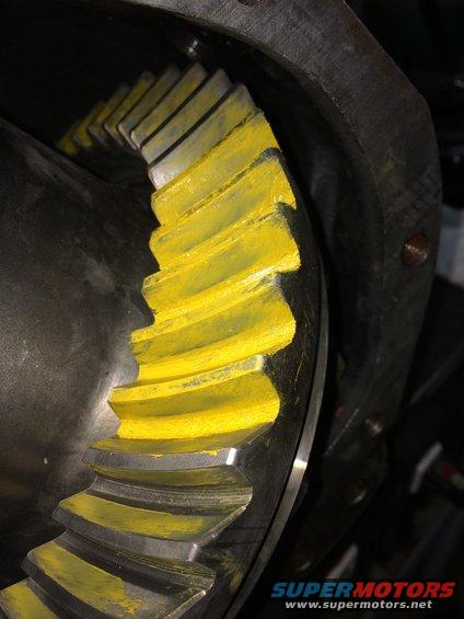 Differential gear with yellow paint markings on teeth, close-up view