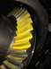 1996 Ford Bronco - Close-up of a differential gear showing yellow paint applied to the teeth for marking.