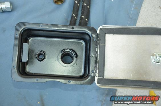 open metal box with two holes, rubber seal, and hinges