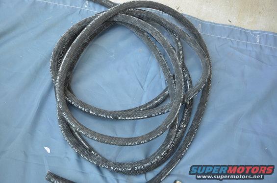Black braided hose with white text reading "WEATHERHEAD 350 PSI MAX. WA. PRESS."