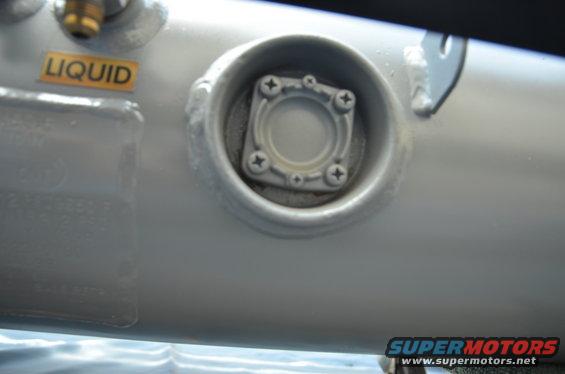 Propane tank fitting with LIQUID label
