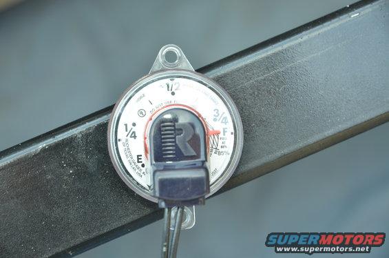 Rochester fuel gauge with E, 1/4, 1/2, 3/4, F markings and a red needle