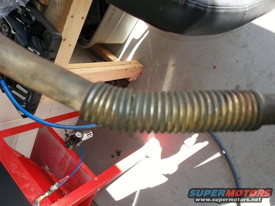 Exhaust pipe with flexible joint, part of a vehicle repair
