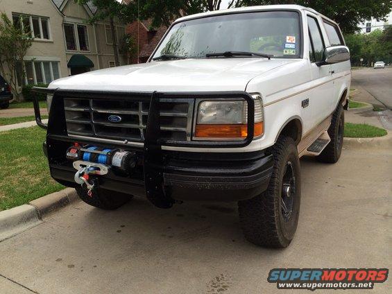 1996 Ford Bronco with aftermarket winch and brush guard mounted on the front bumper