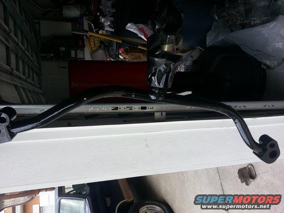 black anti-roll bar with mounting brackets