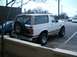 1996 Ford Bronco - This 1996 Ford Bronco is shown from the rear 3/4 angle, a spare tire mounted on the tailgate.