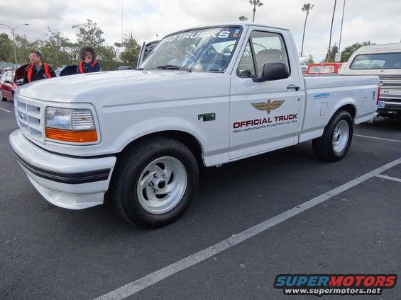 White 1994 Ford F-150 truck with "Official Truck" decal, parked on asphalt