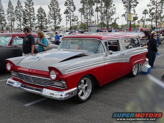 Red and silver two-tone 1957 station wagon with custom wheels
