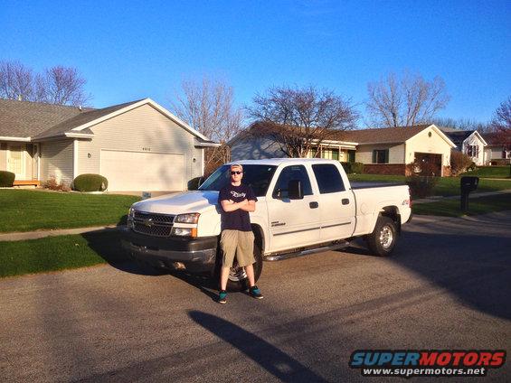 White 2006 Chevrolet Silverado 2500 pickup truck parked in a suburban driveway