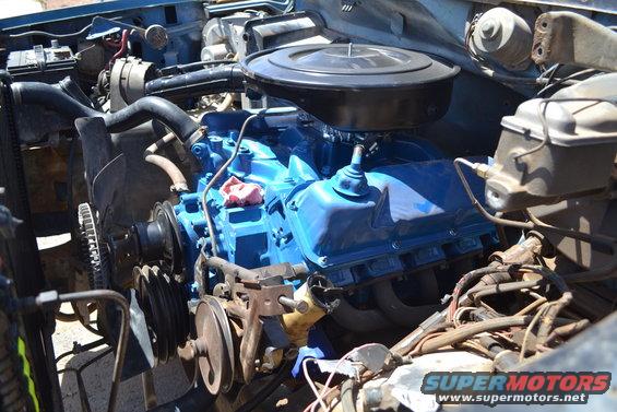 Blue engine in engine bay, close-up view