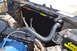1981 Ford F-250 - Close-up view of a vehicle's radiator and engine compartment, showing hoses and other components.