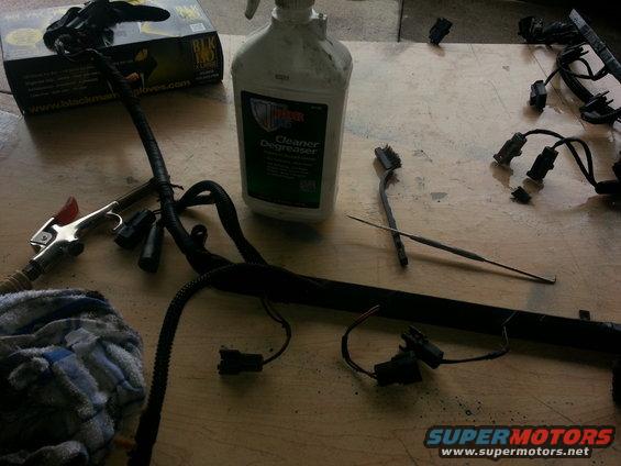 Engine wiring harness with degreaser bottle and gloves
