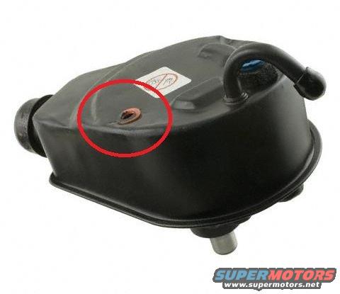 black power steering pump reservoir with a red circle around a small hole
