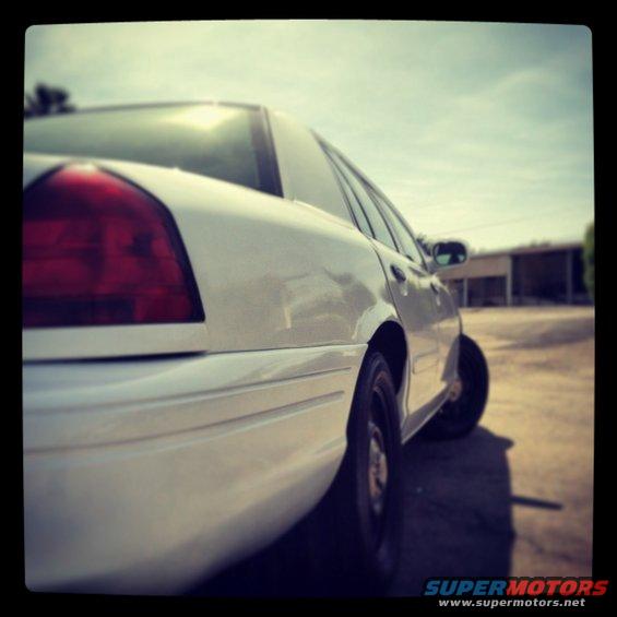 White 2007 Ford Crown Victoria rear quarter panel and taillight