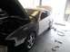 1996 Ford Mustang - This 1996 Ford Mustang is in a garage with its hood and trunk open, likely for repairs or customization.
