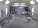 1996 Ford Mustang - Car body parts are prepared for painting inside a booth, with various components on stands.
