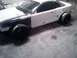 1996 Ford Mustang - This 1996 Ford Mustang is in a garage, showing primer on the front fender and white paint on the rest of the body.