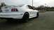 1996 Ford Mustang - Rear view of a white 1996 Ford Mustang GT with black rims.