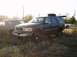 1998 Ford Expedition - Dark gray Ford Expedition parked in a grassy field with another SUV nearby.