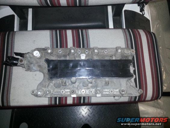 Engine intake manifold on striped upholstery