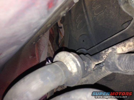 Exhaust pipe and suspension components with Supermotors.net logo