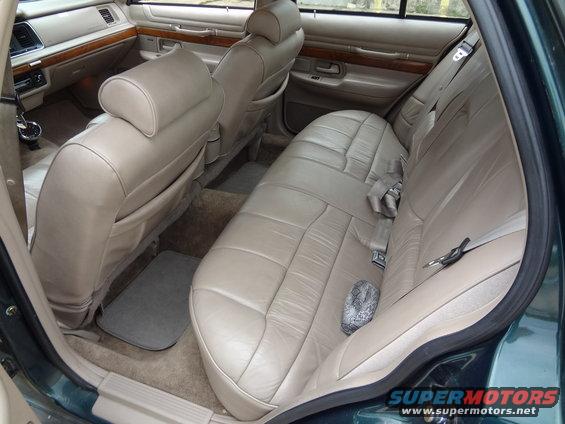 tan leather seats and wood trim inside a sedan