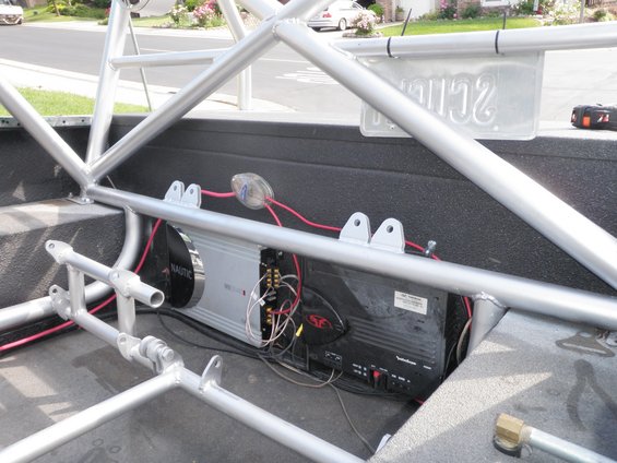 Car stereo amplifiers mounted inside a roll cage