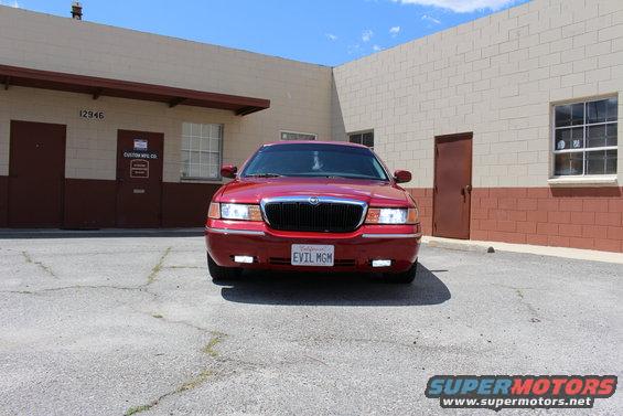 Red 2002 Mercury Grand Marquis with a black grille and California plates