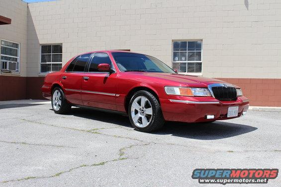 Red 2002 Mercury Grand Marquis sedan, 3/4 front view