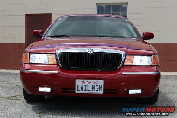 Red 2002 Mercury Grand Marquis front view with custom license plate