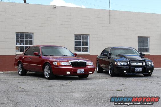 Red 2002 Mercury Grand Marquis and black modified sedan parked side-by-side